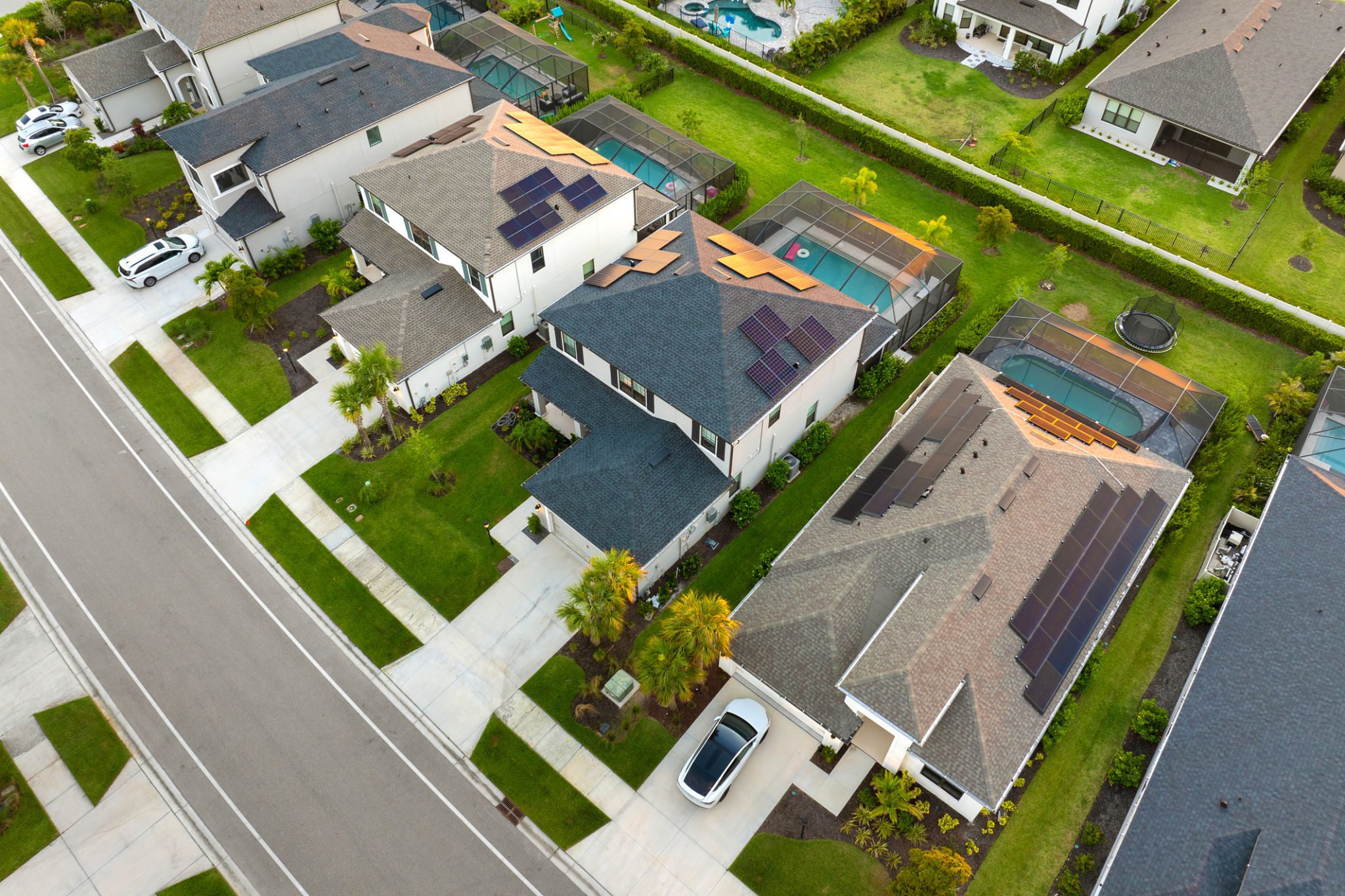 Aerial view of suburban houses with driveways.